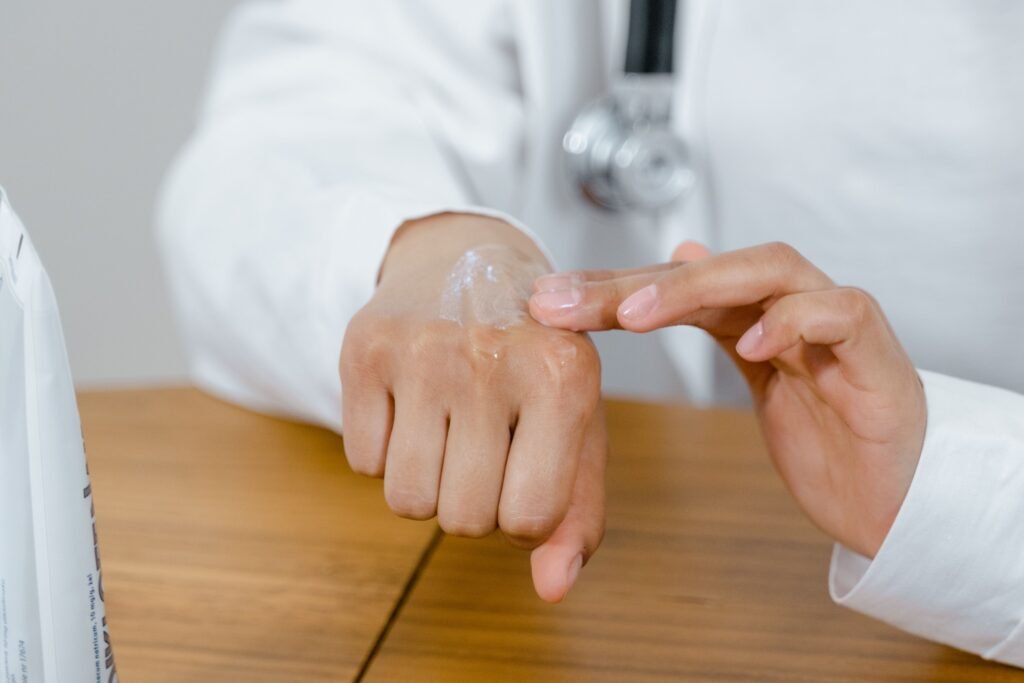 dermatologist applying ceramide moisturizer to repair damaged skin barrier